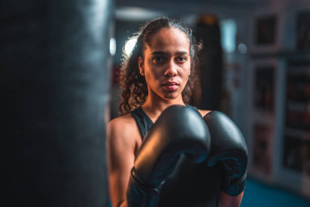 istock Strong Young Hispanic Female Boxer At The Gym 1710528130