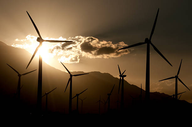 istock Silhouetted Wind Turbine Farm 171053524