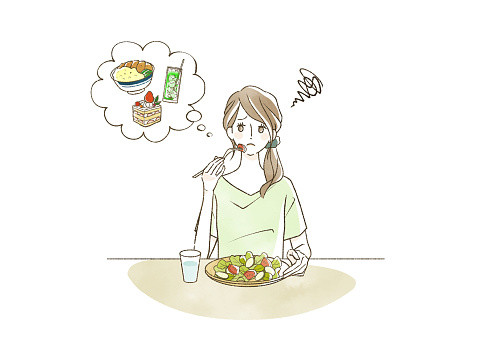 A woman eating an unsatisfactory meal