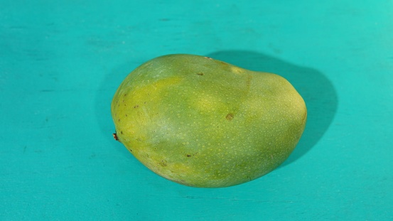 mango fruit on blue background
