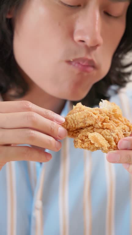 man eat fried chicken