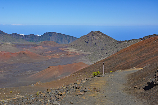 Summit view with hiking trail leading into the sacred Haleakala Crater on Maui island, Hawaii a U..S. National Park