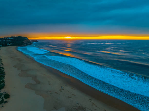 istock Sunrise at the seaside and lagoon with cloud cover 1710638434