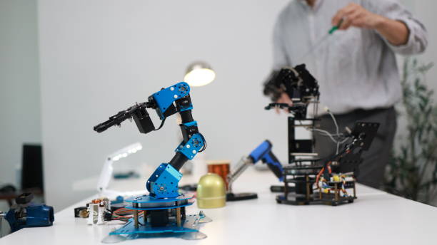 istock The young male mechatronics engineer is examining and analyzing a robotic arm for a new project. 1710638647