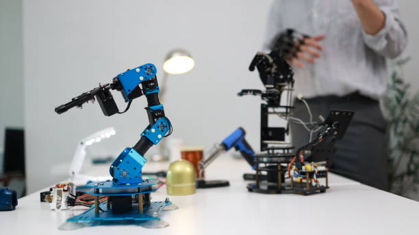 istock The young male mechatronics engineer is examining and analyzing a robotic arm for a new project. 1710638655