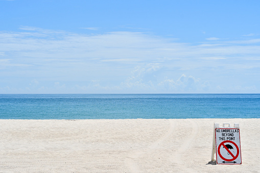 View of calm blue ocean on an empty beach in Vero Beach, Florida on Hutchinson Island