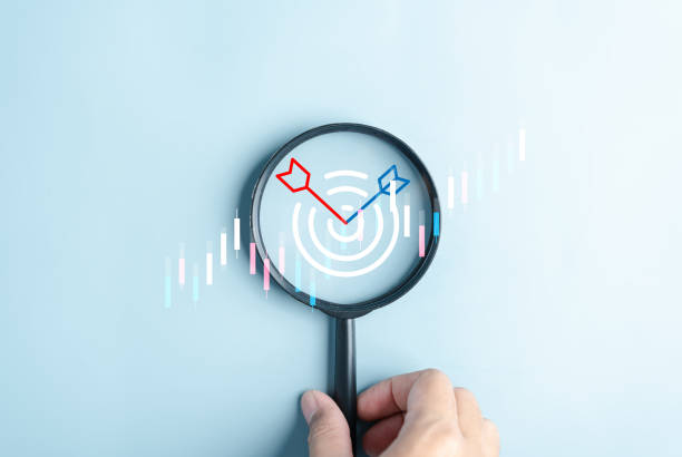 istock Magnifier glass focus to target objective with business icons. planning development leadership and customer target group concept. 1710692163