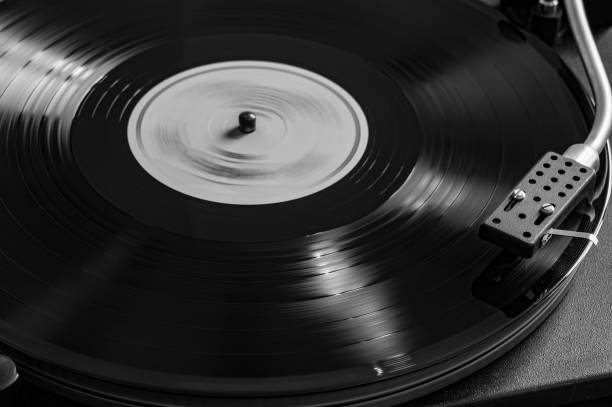 istock Record player, vinyl turntable record player, while playing the record. black and white film simulation 1710712261
