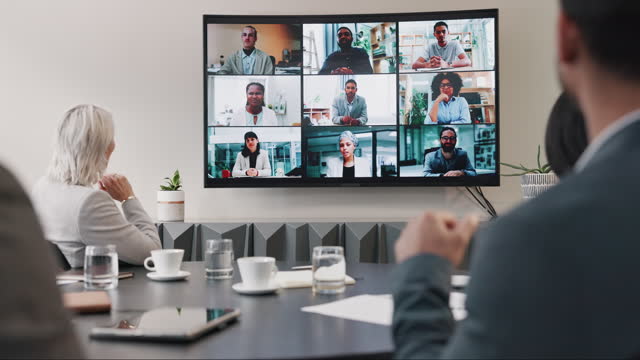 Business people, video conference and meeting of team in boardroom for online presentation, discussion and wave hello. Group, virtual communication and global webinar call on digital screen in office