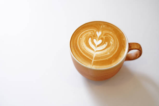 istock Hot latte coffee with latte art in the white cup on the white background. Copy space. 1710774652