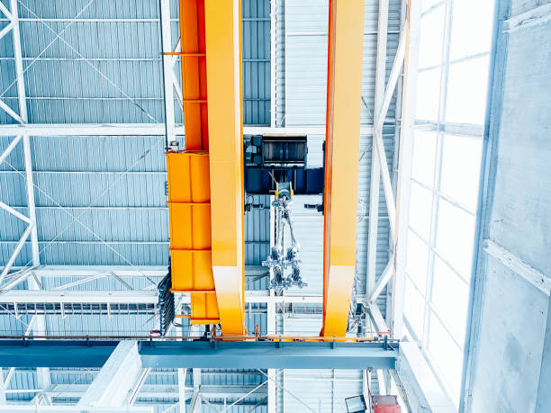 istock Overhead crane inside factory building, industrial background. 1710801134
