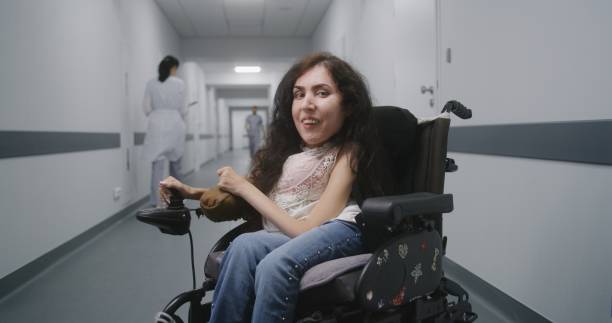 istock Woman with spinal muscular atrophy looks at camera 1710805321
