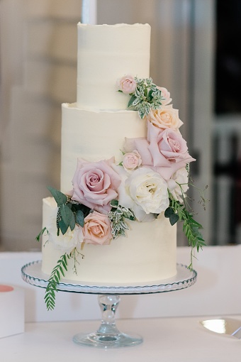 beautiful wedding cake lit by the sun's rays