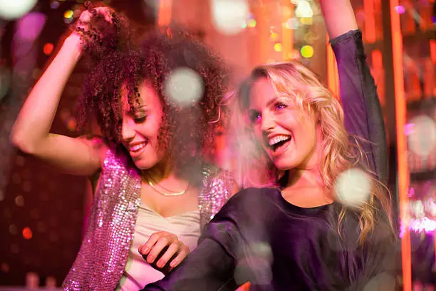 Photo of Friends dancing in nightclub