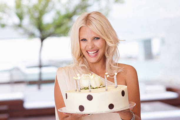 Portrait of woman holding birthday cake  woman birthday cake stock pictures, royalty-free photos & images