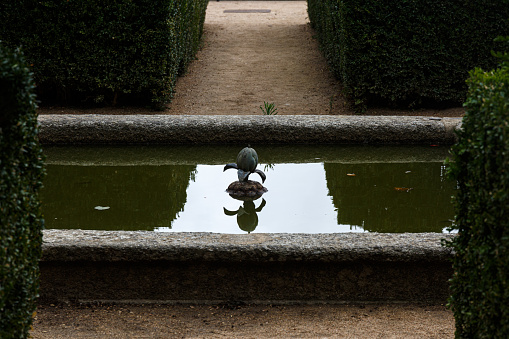Small metail fountain in the garden of Escorial monastery