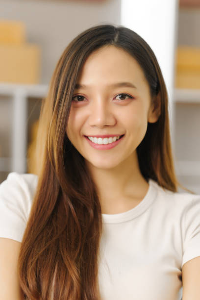 istock Confident Asian china people SME owner diligently packing products into boxes, epitomizing the e-commerce shift. As orders flood her inbox 1710914752