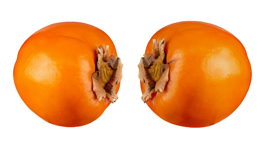 Ripe orange persimmon fruit isolated on white background. File contains clipping path. Full depth of field.