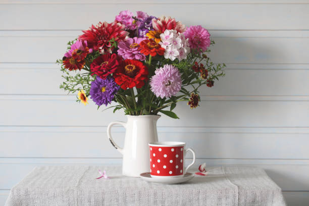 istock rustic still life, garden flowers in a white jug. 1710947590