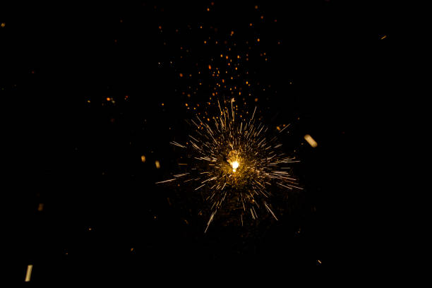istock Sparks of a fire during the night, black background. 1710967016
