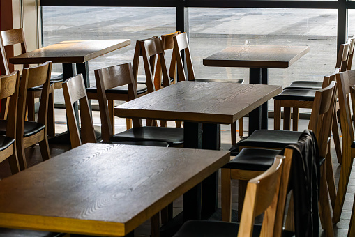 Empty table and chairs in modern restaurant