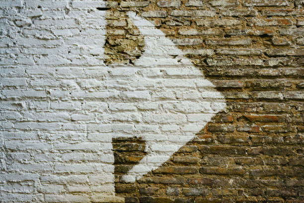 istock Brick wall with big white arrow indicating direction, background with copy space. 1710979174