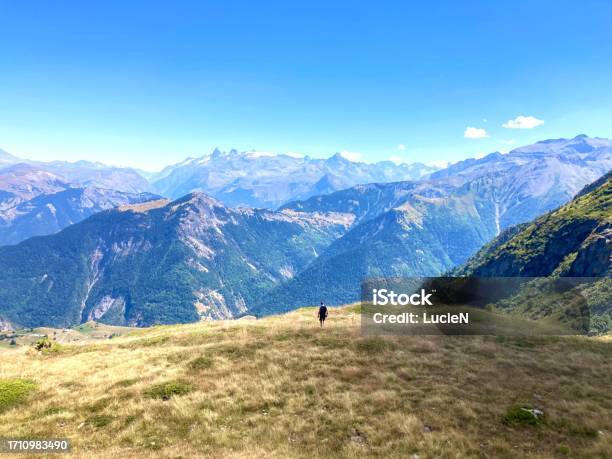 A Hiking Man Passing Through Mountains Stock Photo - Download Image Now - Activity, Adults Only, Adventure