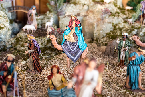 Small figures of people and animals recreate Christmas.