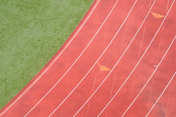 Top view track A top view of part of the infield and a lanes of a running track. rubberized stock pictures, royalty-free photos & images