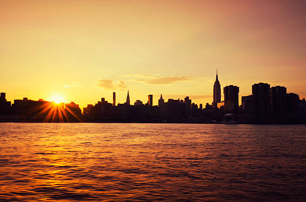 istock silhouette skyline of Manhattan on sunset 171100186