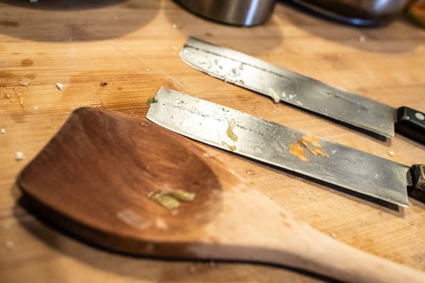 istock Steel kitchen knives and wooden spoon. 1711006398