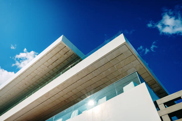 istock White business building with a colorful blue sky, space for copy text for advertisers. 1711012516