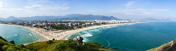 Rio de Janeiro beaches panorama Panoramic shot of 2 beaches at Rio de Janeiro. Pontal (left) and Recreio (right). headland stock pictures, royalty-free photos & images