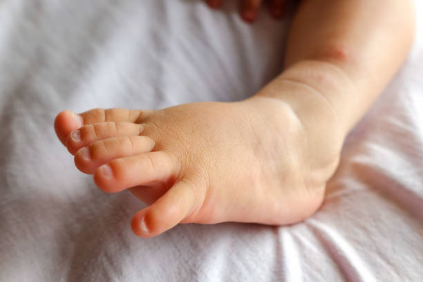 istock Instep of a baby's barefoot. 1711018037