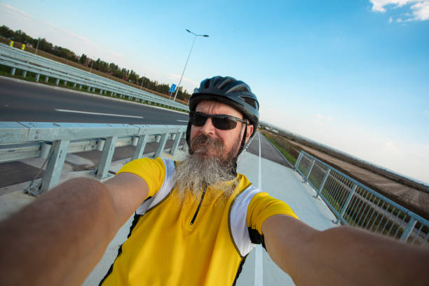 istock 50 years old cyclist selfie from cycling lane 1711018052