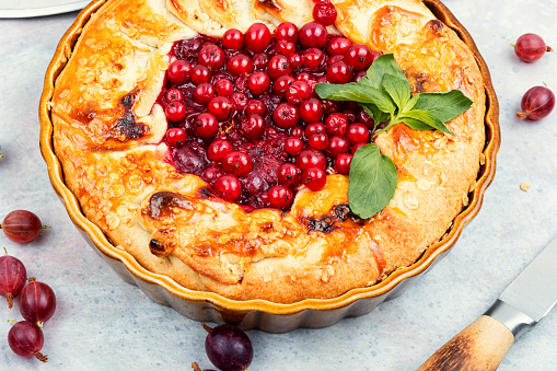 Summer pie or tart with red currants and gooseberries.