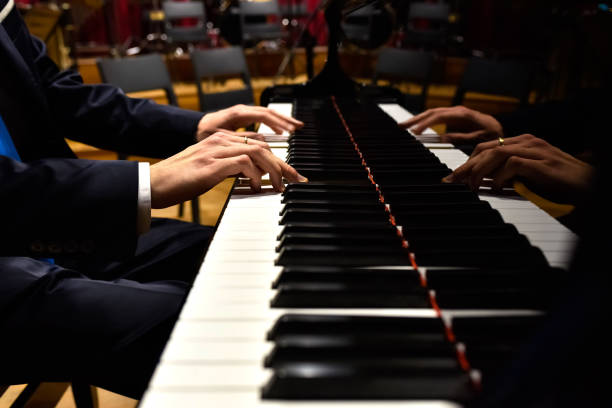 istock Professional pianist performing a piece on a grand piano. 1711031936