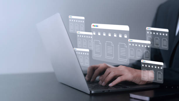 istock Business document icon. Business people using laptop computer to store documents and search for information. Document transferring concept. searching and managing files. 1711050505
