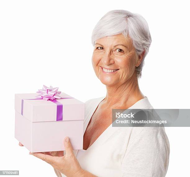 Smiling Elderly Woman Holding A Birthday Gift Isolated Stock Photo