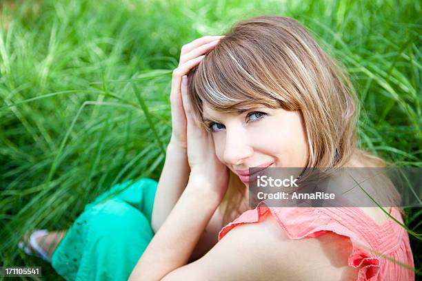 Young Beautiful Female Smiling With Hands In Hair Stock Photo - Download Image Now - 20-24 Years, 20-29 Years, 25-29 Years