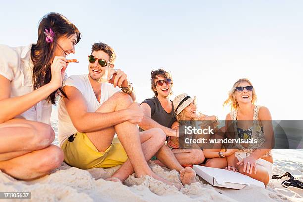 Young People Enjoying A Beach Party Stock Photo - Download Image Now - Beach, Friendship, Pizza