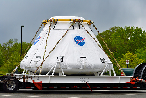 Chantilly, Virginia, USA - April 23, 2012: A NASA space capsule in a protective covering is chained down to a flatbed trailer awaiting transportation. (Photo by John M. Chase)