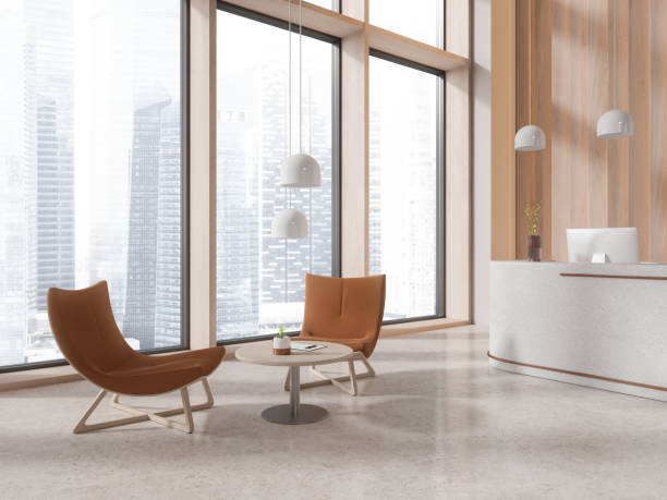 istock Stylish office interior with reception desk and chill zone with panoramic window 1711058144