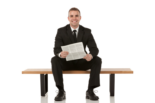 Businessman sitting on bench and holding a newspaperhttp://www.twodozendesign.info/i/1.png