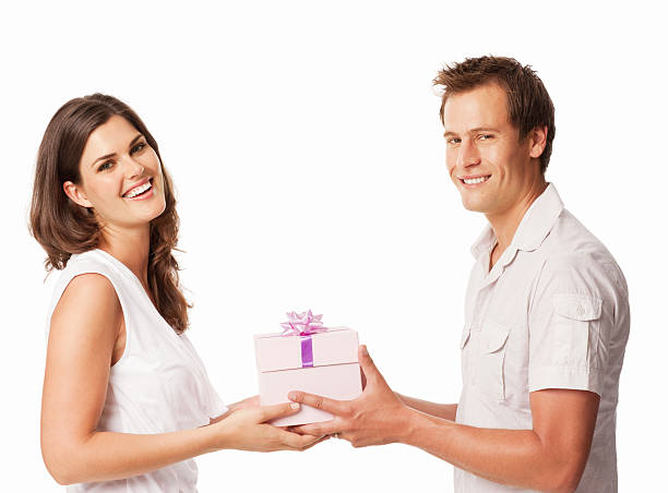 istock Young Couple Giving a Gift - Isolated 171106050