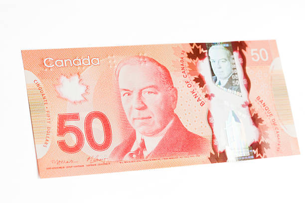 New Polymer Canadian Fifty Dollar Bill - Front Angle Front of the new Canadian 50 dollar bill, released into circulation March 26, 2012. Made from a polymer of biaxially-oriented polypropylene (BOPP) it makes the bills more durable and harder to counterfeit. The front depicts Canada's 10th Prime William Lyon Mackenzie King. canadian currency photos stock pictures, royalty-free photos & images