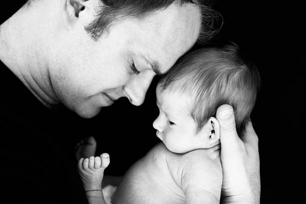 istock Tenderness Between Father and Newborn Baby 171106199