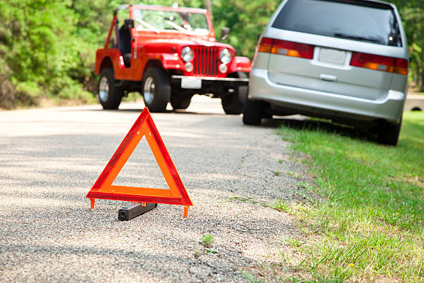 istock Two car accident with focus on orange triangle warning sign. 171107597