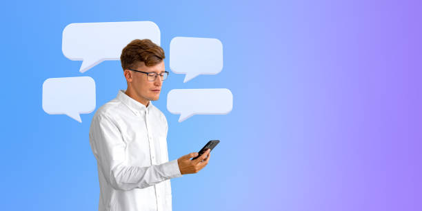 istock Concentrated businessman with smartphone, text message bubbles mock up 1711079134