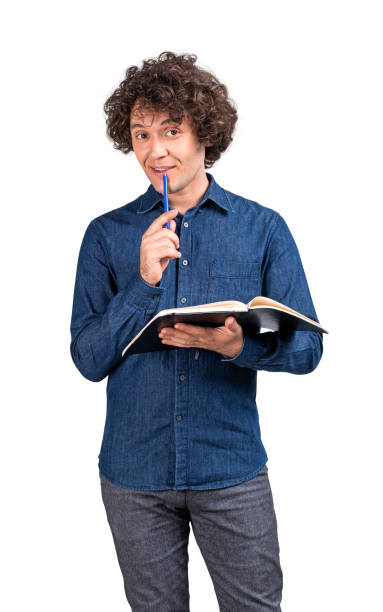 istock Pensive man with notebook in hand, isolated over white background 1711082044
